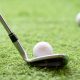 Selective,Golf,Club,And,Golf,Ball,On,Green,Grass,Background.iron